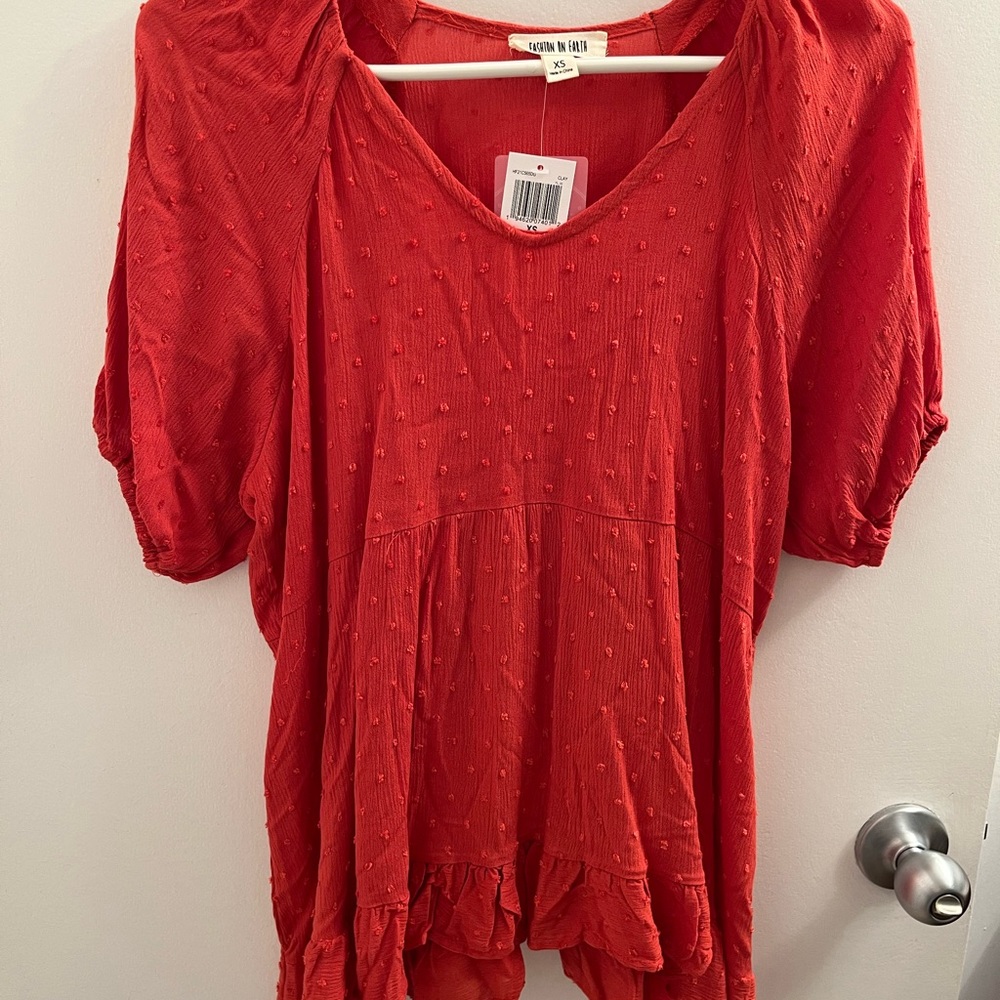 Tomato ruffled top chic for a cute outfit